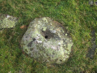 A rock with a hole in it.