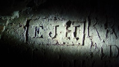 Initials on graffiti wall