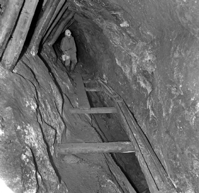 Water launder over stoping, South Caradon adit 1979