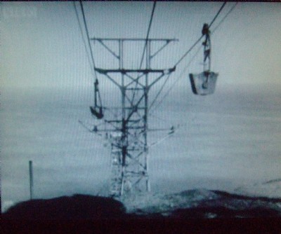 Aerial flight pylons heading out to sea