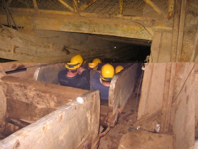 Man riding skip in El Silencio Shaft
