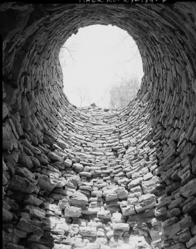 INTERIOR VIEW UP THE INSIDE OF THE FURNACE STACK.
