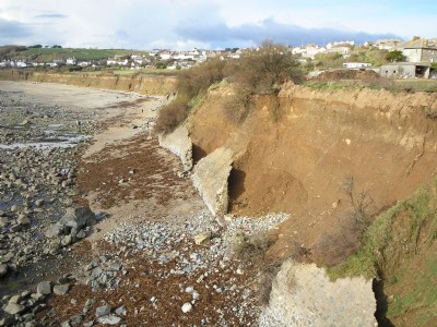 Breached sea defences at the site