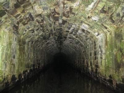 Drainage adit viewed through locked gate