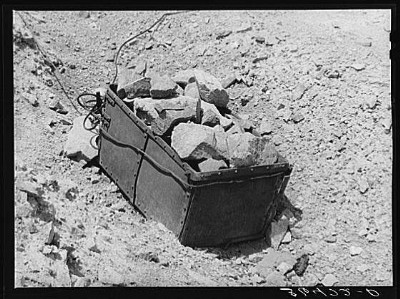 Old ore bucket and gold ore 1940