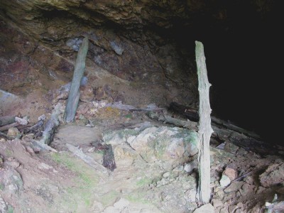 Rotten wooden props supporting roof